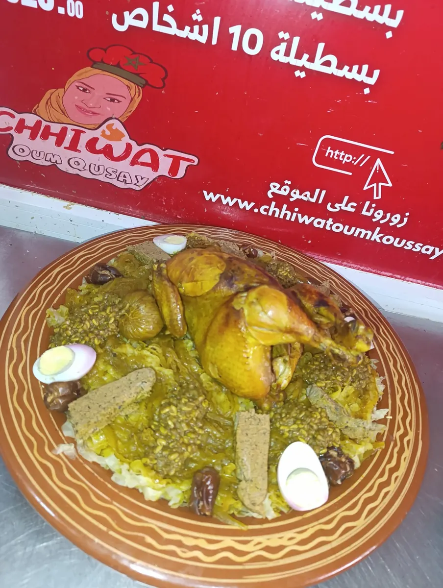Chicken rfissa with lentils and egg pieces in a traditional earthenware platter