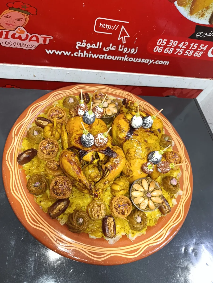Rfissa platter decorated with nuts, dates and eggs at Chhiwat Oum Qusay