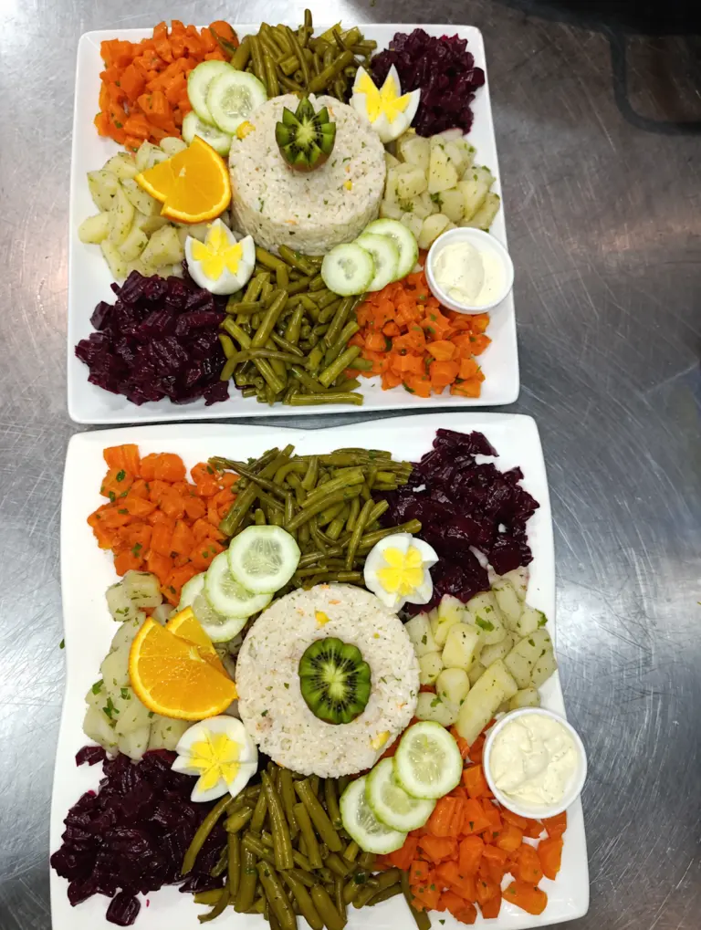 Two plated Niçoise salads prepared at Chhiwat Oum Koussay
